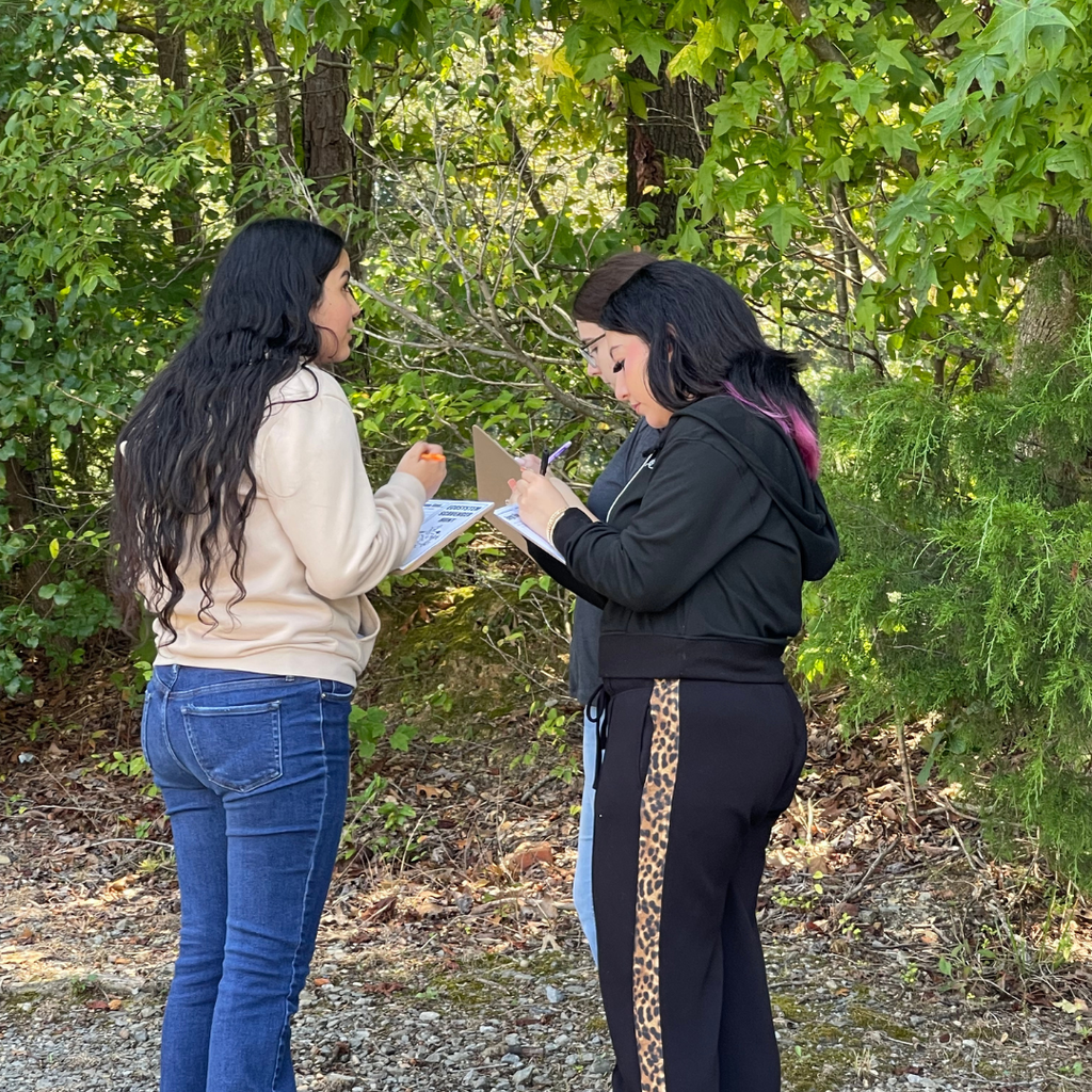 Mrs. Weaver's Environmental Science participating in an ecosystem scavenger hunt for Unplugged Wednesday