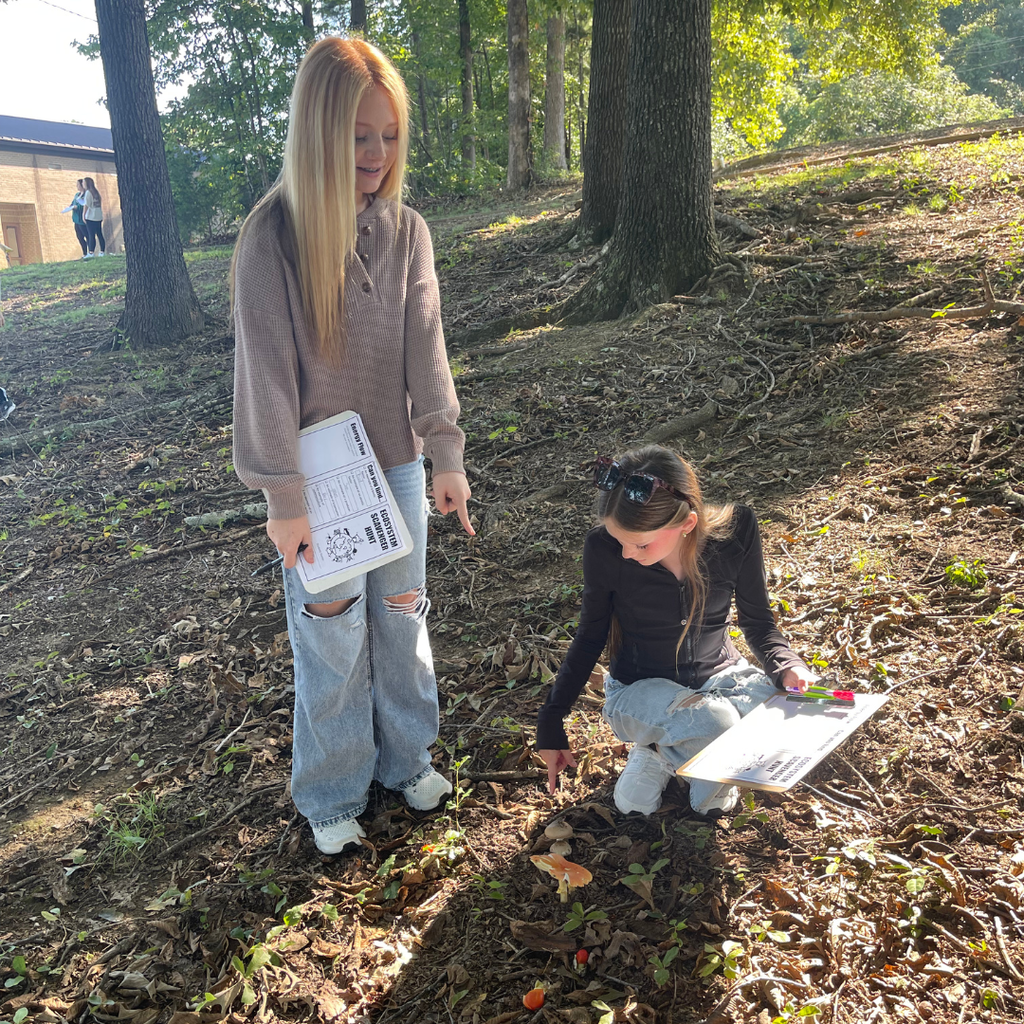 Mrs. Weaver's Environmental Science participating in an ecosystem scavenger hunt for Unplugged Wednesday