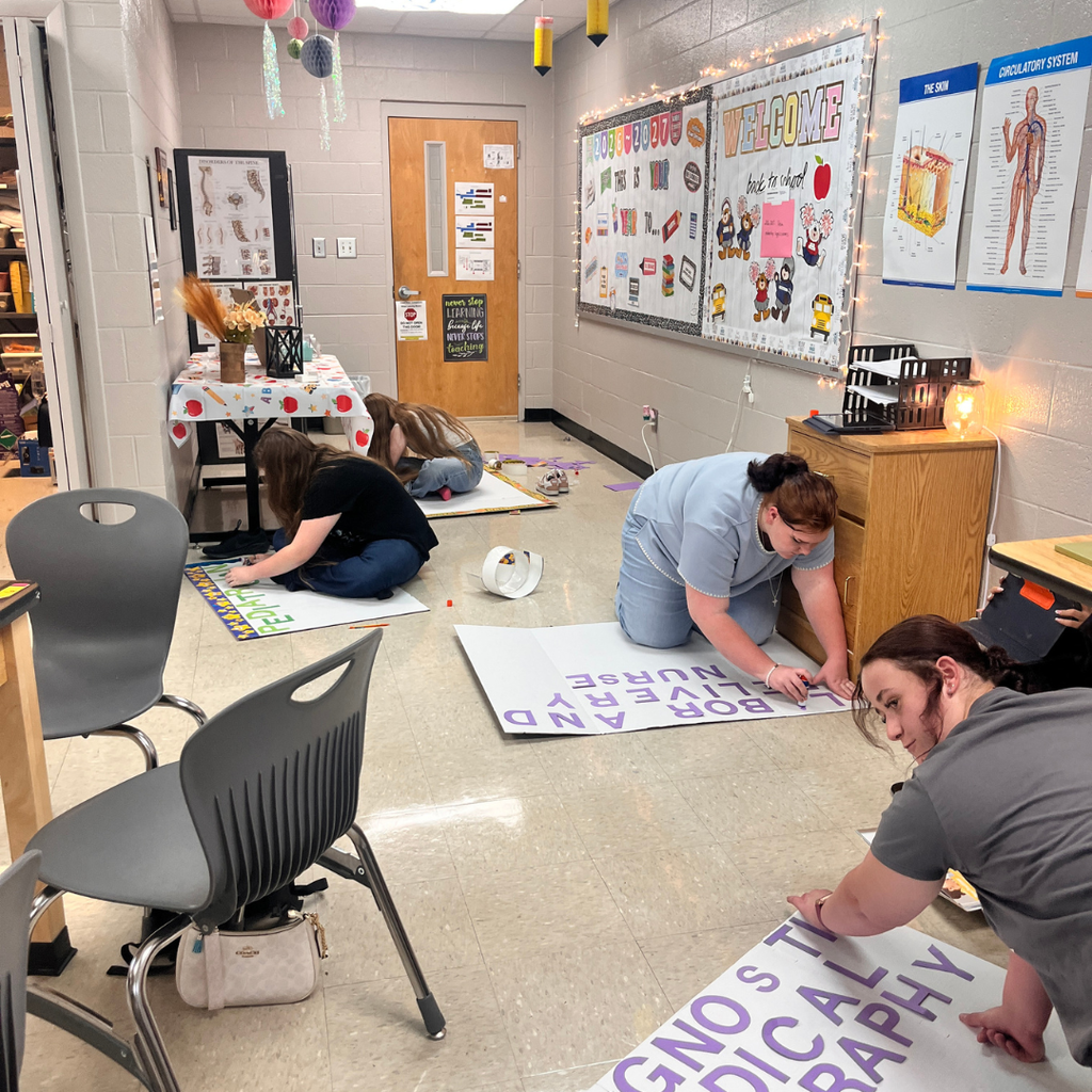 Mrs. Lee's Intro to Healthcare class working on research projects about healthcare professionals