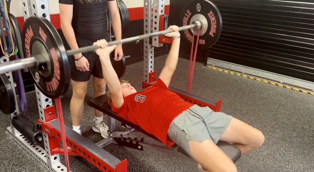 SHS students in weight training lifting.