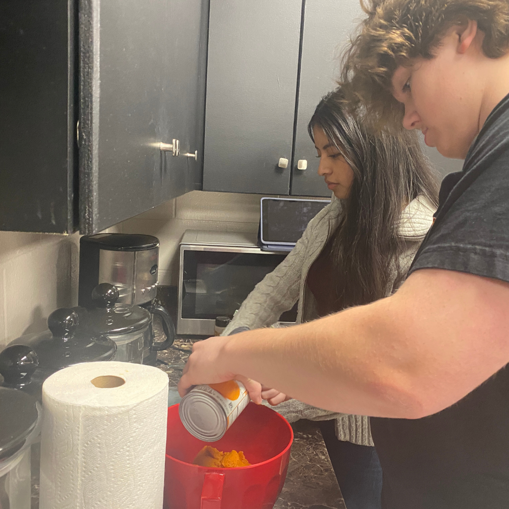 Mrs. Worley's Spanish 4 students wrapping up a unit on Puerto Rico by making a traditional spiced pumpkin pudding.