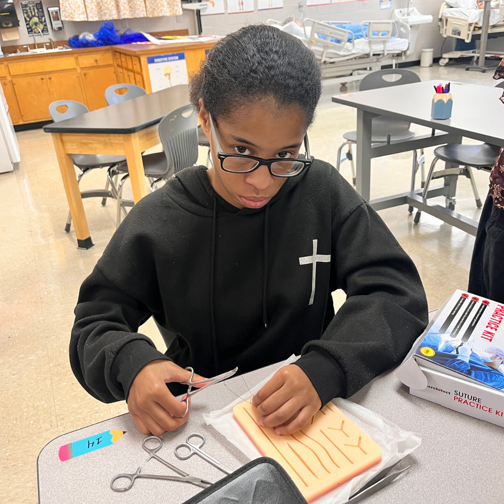Future healthcare professionals in action! 🩺✂️ Mrs. Lee's Allied Healthcare students are learning about surgical incisions, wounds, and sterile technique. Today, they put their knowledge into practice by using skin pads to learn basic suturing skills. For a first-time experience, they did an amazing job!