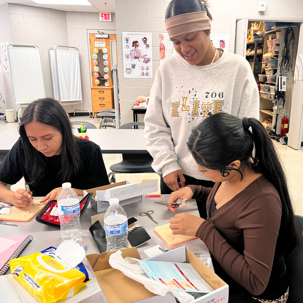Future healthcare professionals in action! 🩺✂️ Mrs. Lee's Allied Healthcare students are learning about surgical incisions, wounds, and sterile technique. Today, they put their knowledge into practice by using skin pads to learn basic suturing skills. For a first-time experience, they did an amazing job!