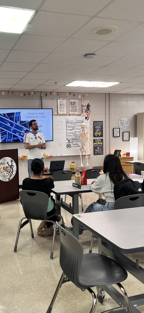 Mr. Worley, WBL teacher, talking to Mrs. Lee's Allied Healthcare about opportunities after high school