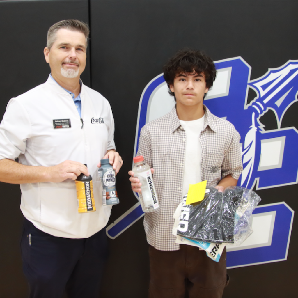 Nathan Medlock (Coca Cola rep) with Junior Martinez (Cross Country) - Aug. 2026 Player of the Month