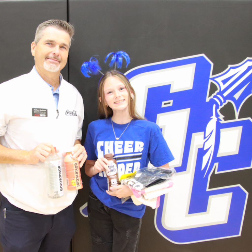 Nathan Medlock (Coca Cola rep) with Peyton Bodiford (Cheer) - Aug. 2026 Player of the Month