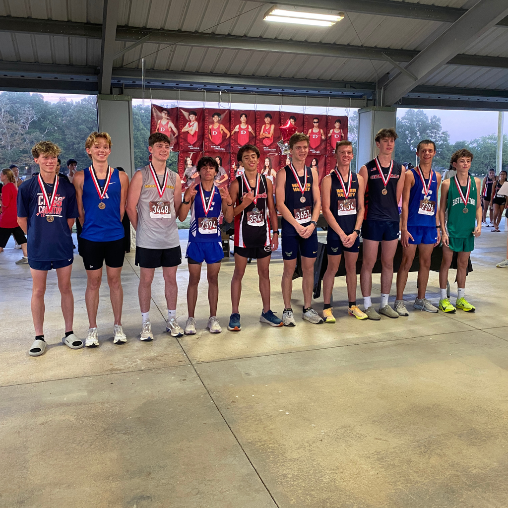 Cross Country team members receiving their medals at a recent meet