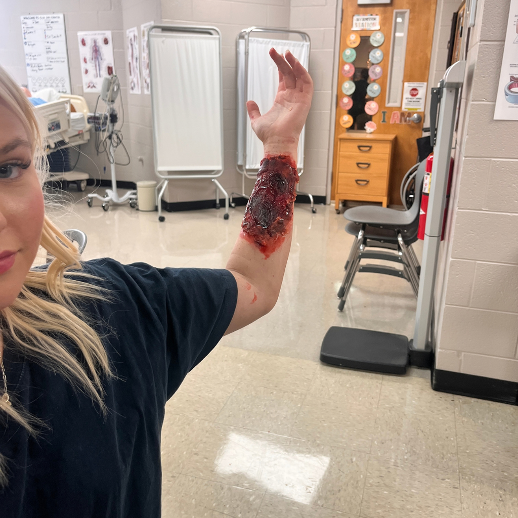 Mrs. Lee's Allied Health Care students practicing sterile wound care techniques