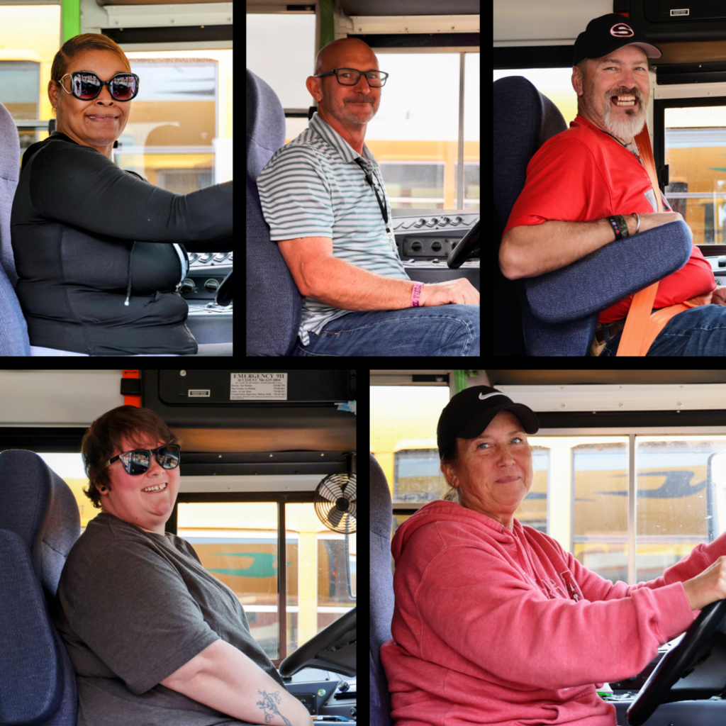 School bus drivers in their buses