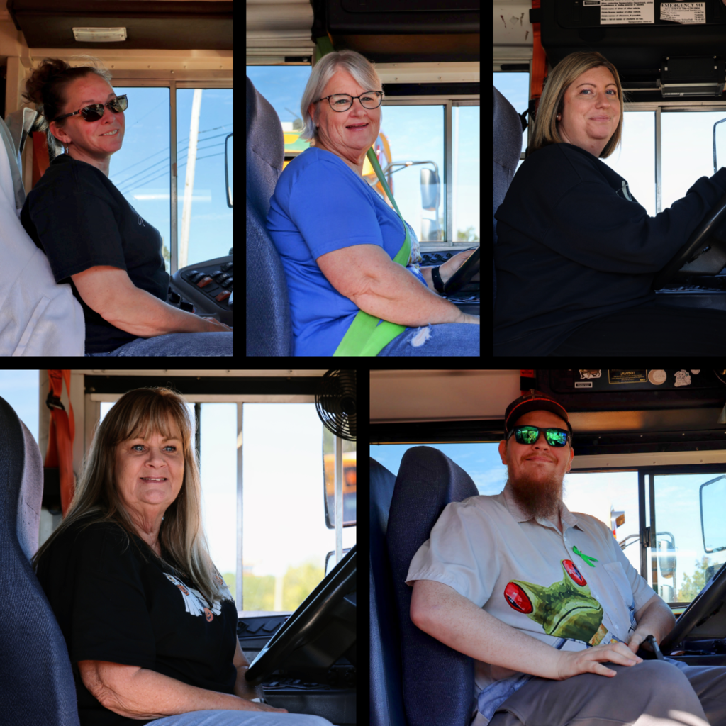 School bus drivers in their buses
