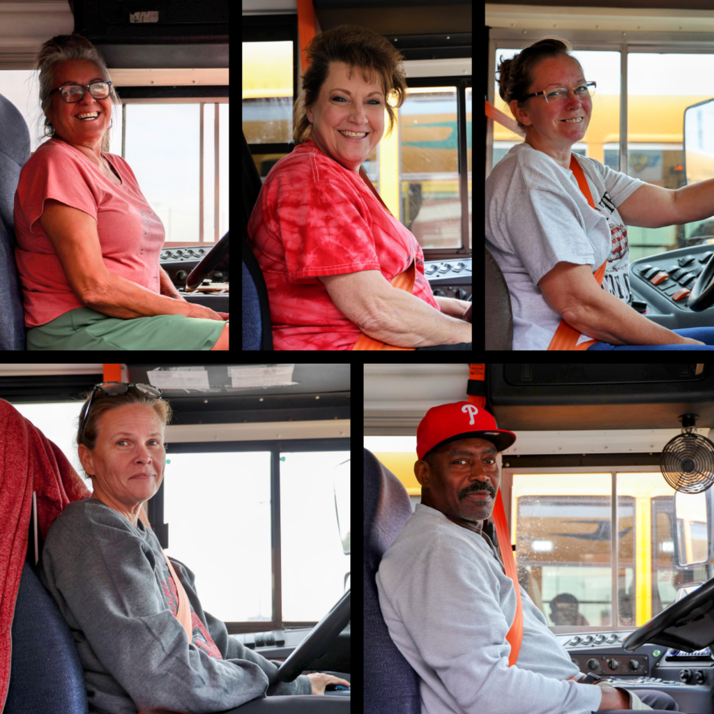 School bus drivers in their buses
