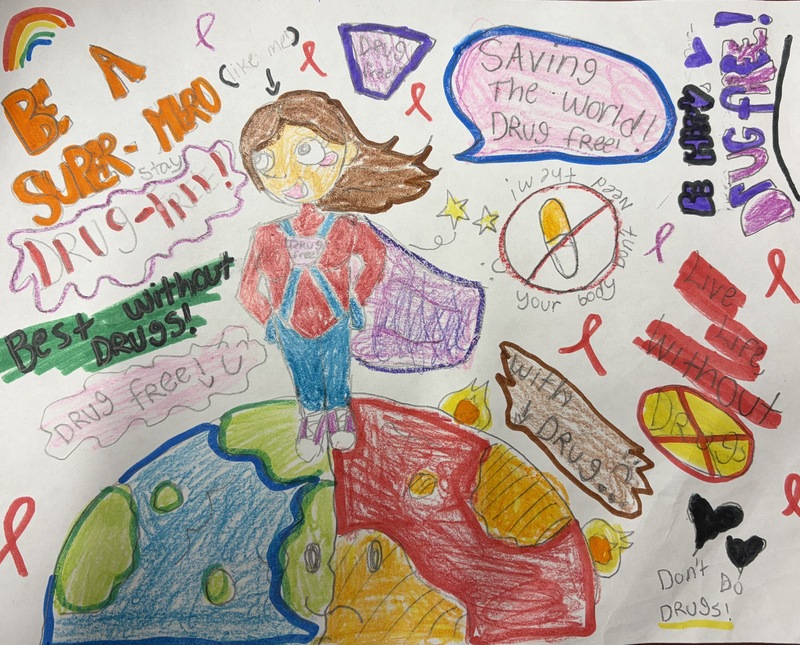 Colorful hand-drawn poster featuring a superhero standing on Earth, red ribbons, and drug prevention messages, including “Be a superhero—stay drug-free!” and “Saving the world drug-free!”