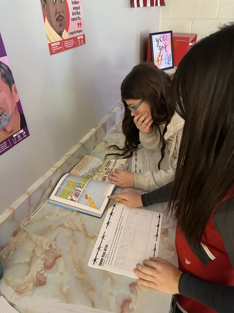 GMS students in Ms. Middick's class completed stations on the Holocaust to gain background knowledge before they read their next novel. 