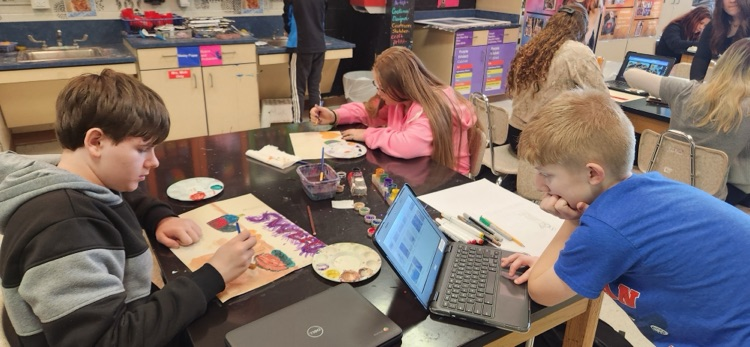 Students working on painting color study pastries and their own projects that they developed