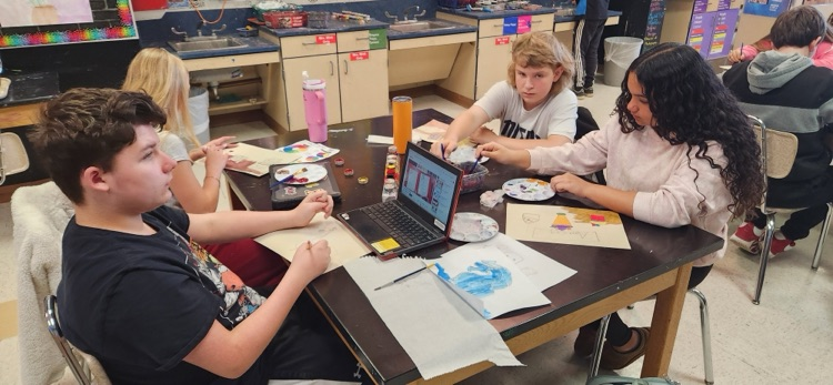 Students working on painting color study pastries and their own projects that they developed