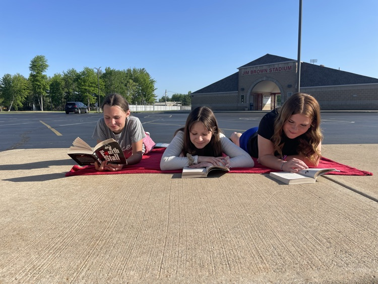 Mrs. Fine's 6th grade ELA students took full advantage of a beautiful day by reading outside!