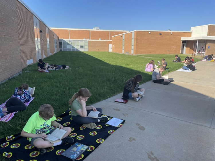 Mrs. Fine's 6th grade ELA students took full advantage of a beautiful day by reading outside!