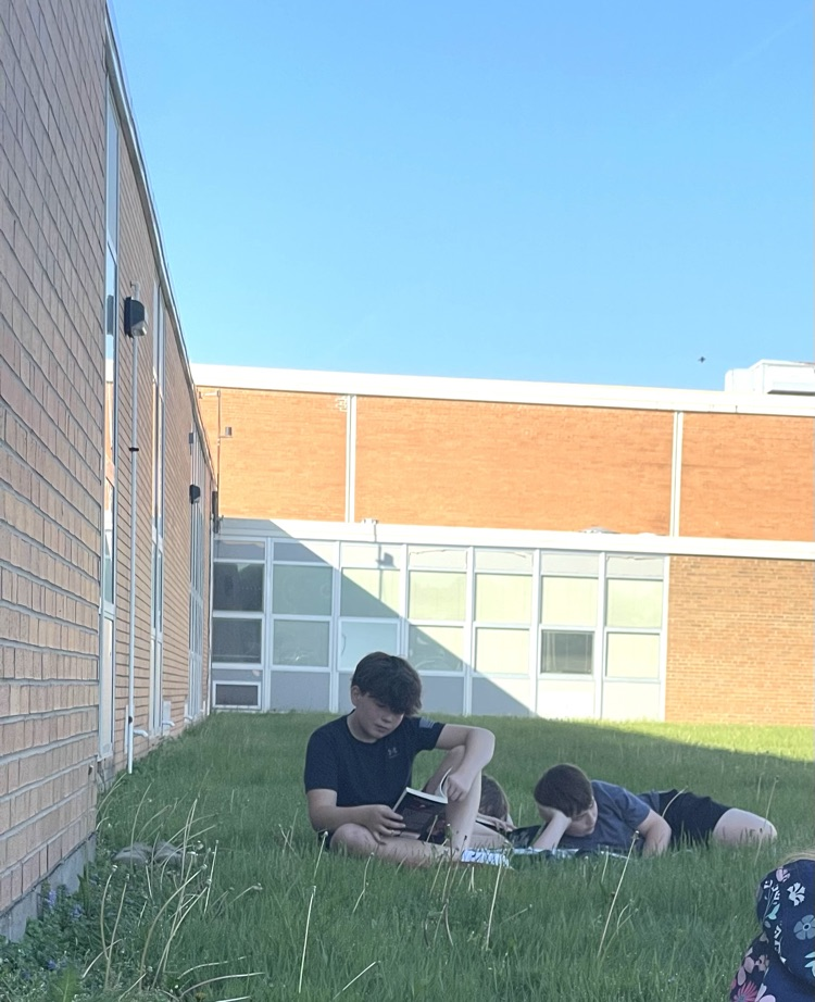 Mrs. Fine's 6th grade ELA students took full advantage of a beautiful day by reading outside!