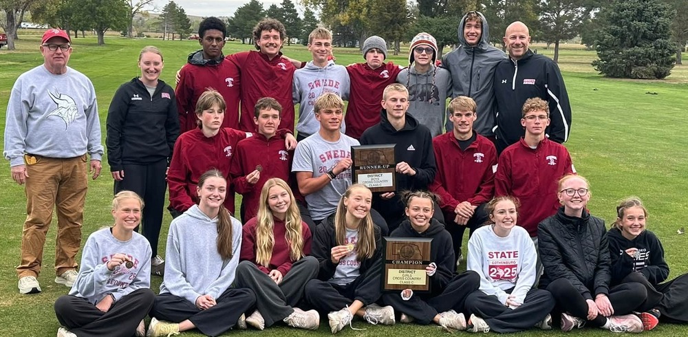 Boys and Girls Cross Country teams posing with District Championship and Runner Up Plaques.