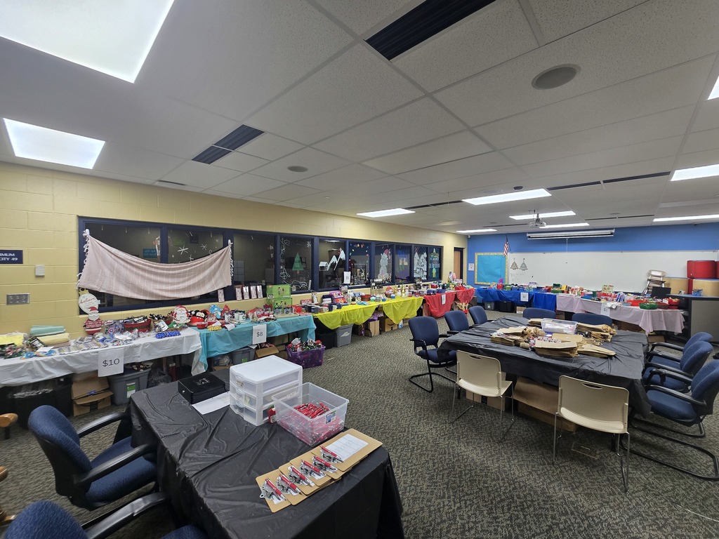 Classroom full of multi colored tables full of items for GES PTO Holiday Shop