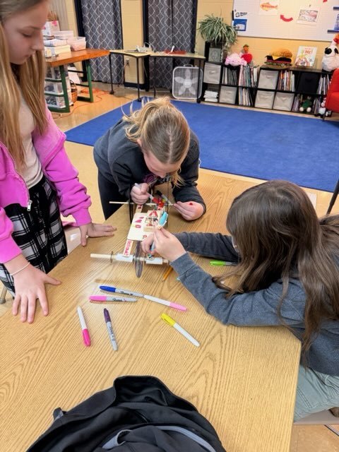 girls working on mouse trap car