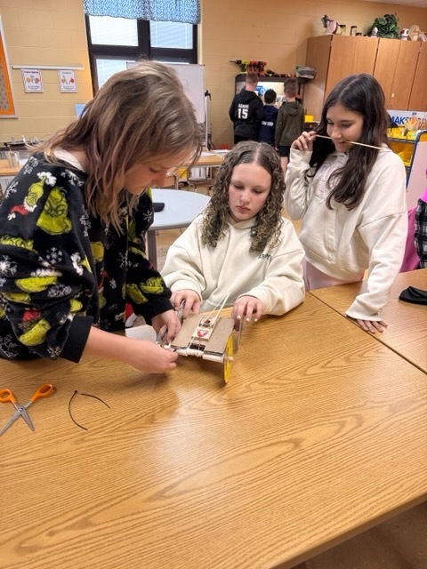 girls working on mouse trap car