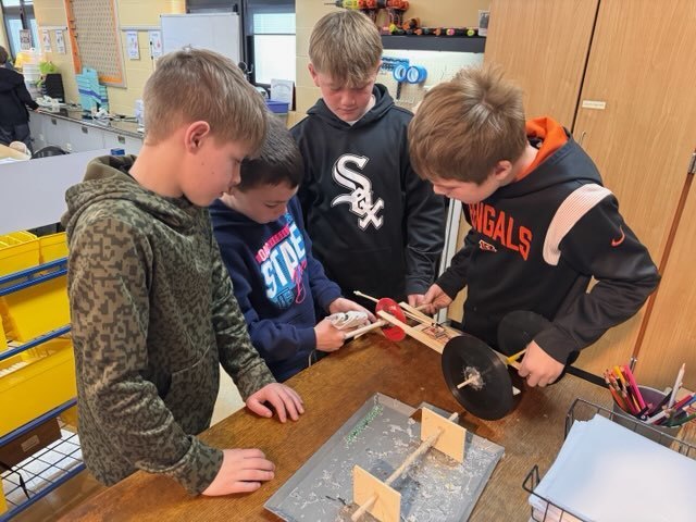 boys working on mouse trap car
