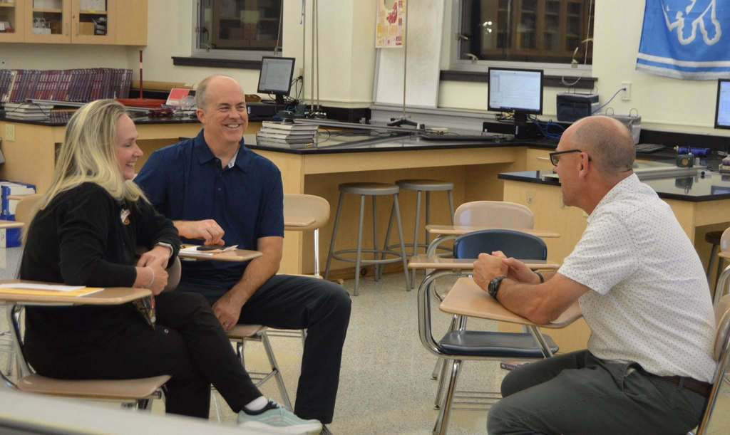 Parents with a teacher