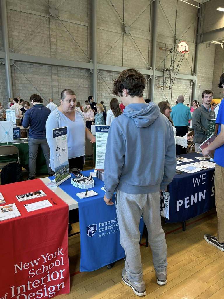 Student looking at a college booth