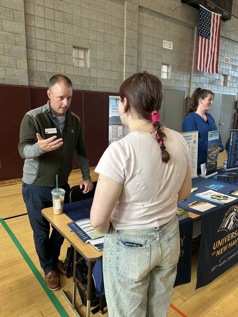 Student looking at a college booth