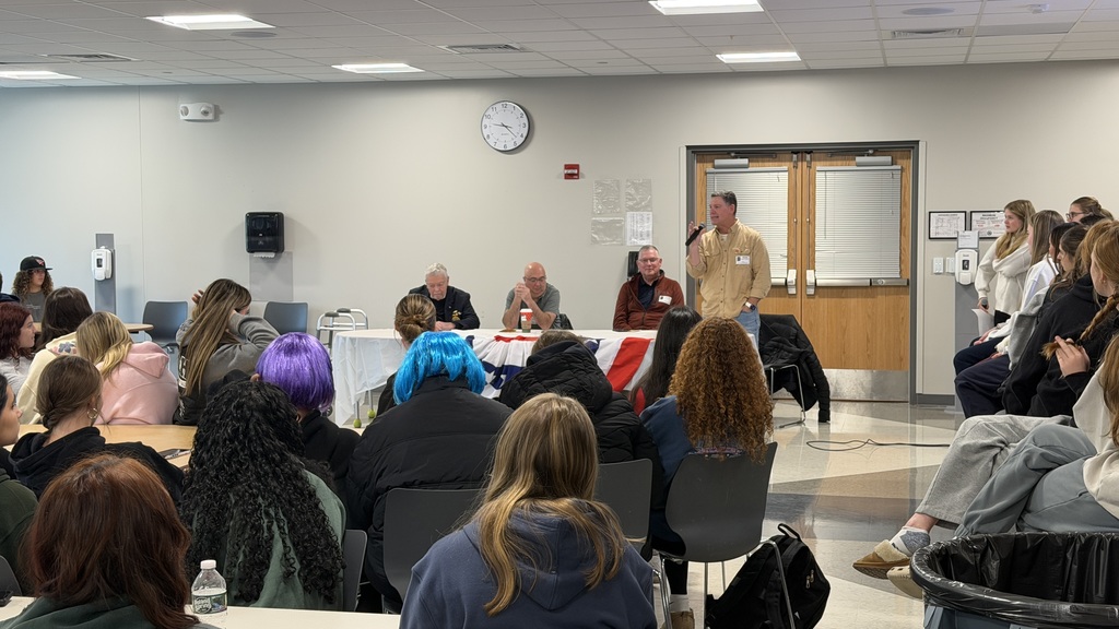 Panel photo of veterans speaking to students 
