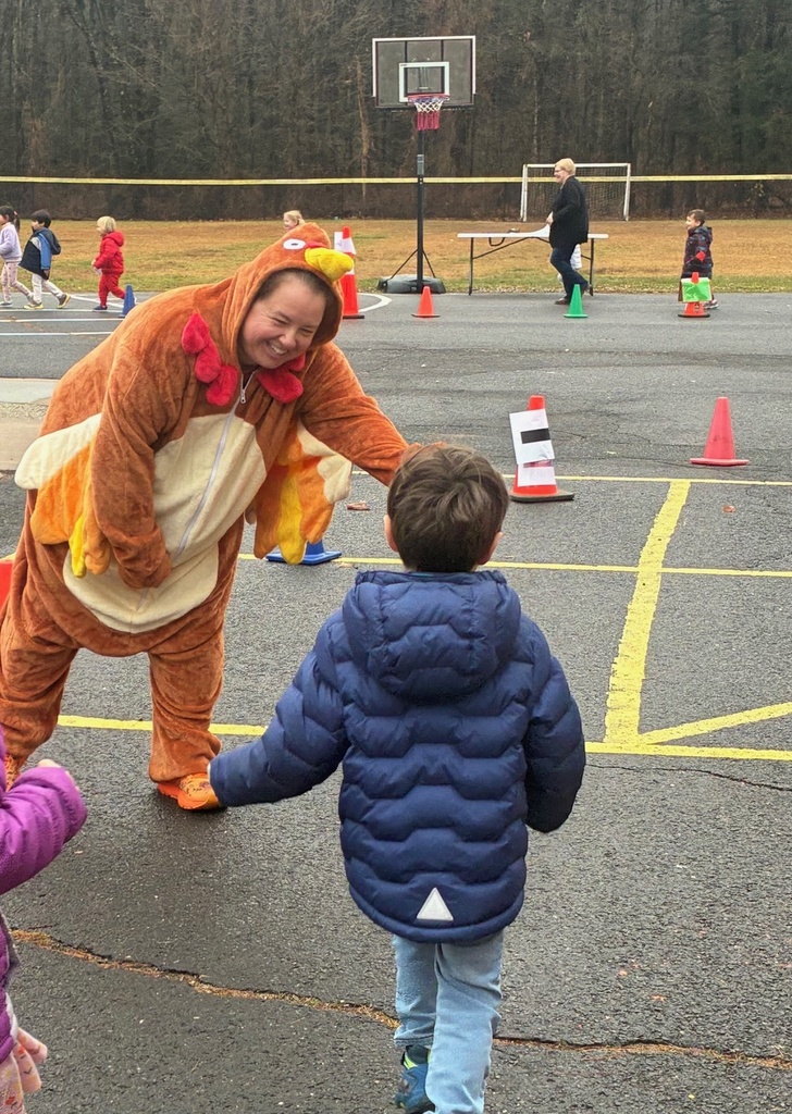 Ms. K giving a student a high five