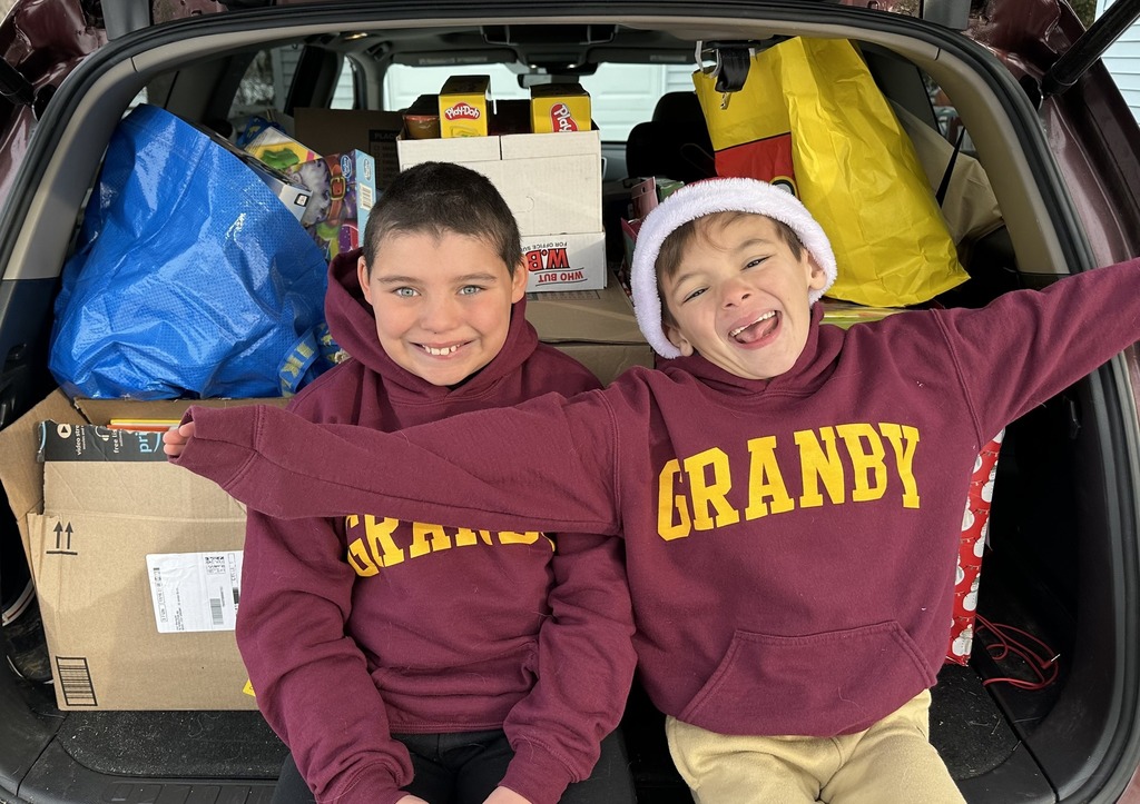 Salvador Okenquist (1st grade) and Greyson Okenquist (4th grade) helping deliver toys to CCMC