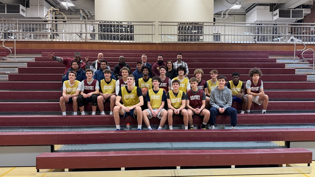 Students and staff sit on the new bleachers