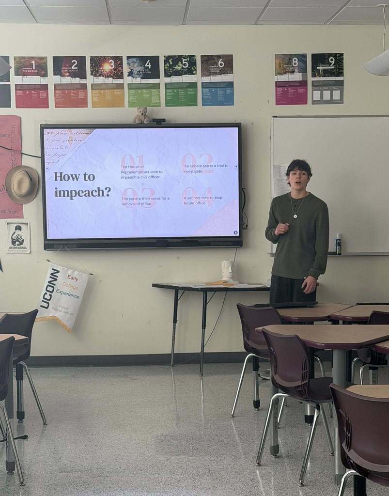 A student presenting their capstone project on impeachment 