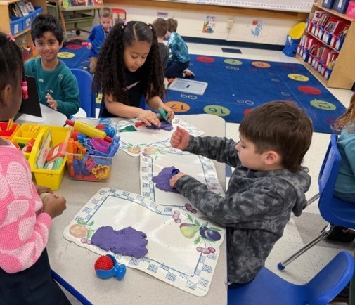 student playing with playdough