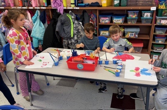 students painting with water color
