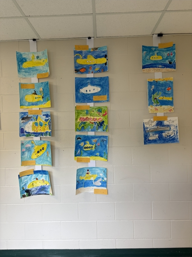 Class paintings hanging on a wall.