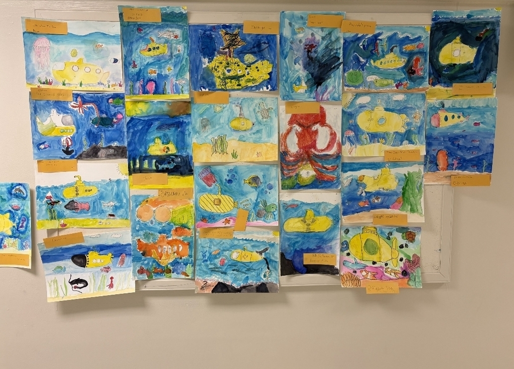 Class paintings hanging on a wall.