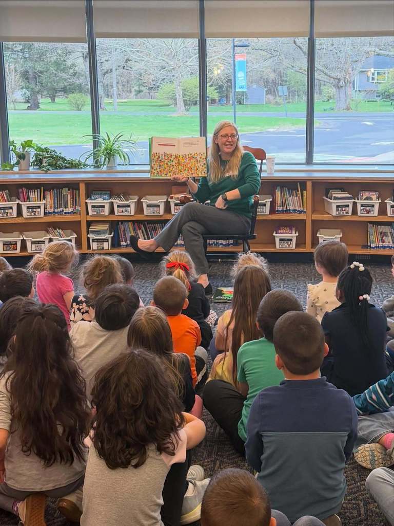 The Director of Granby Public Library reading to students