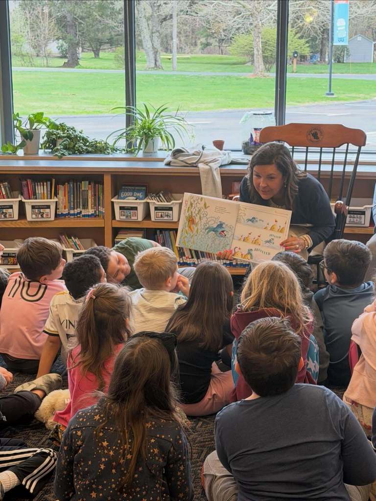 Superintendent Burke reading to students