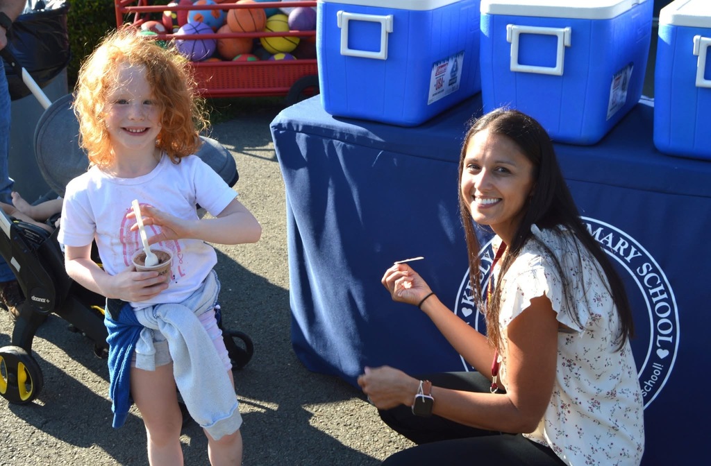 Kelly Lane Principal with a student 