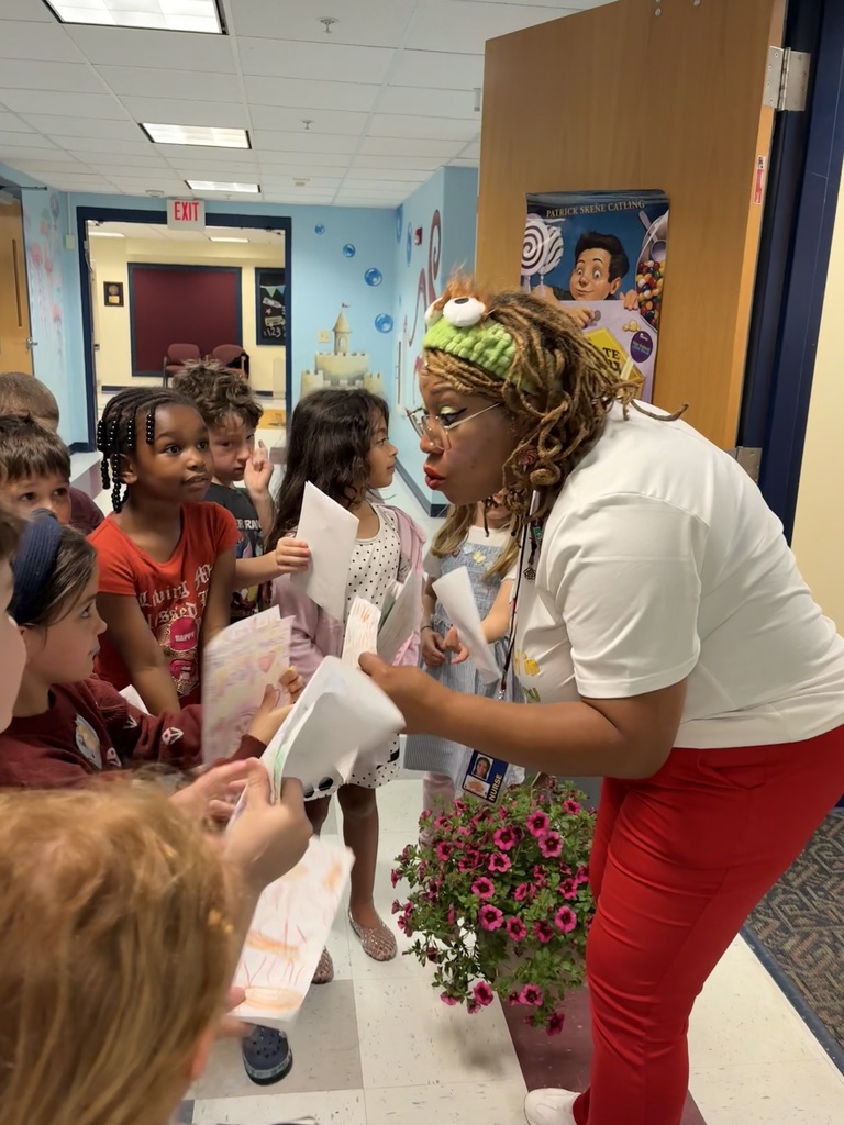 Nurse Dom getting cards from students.