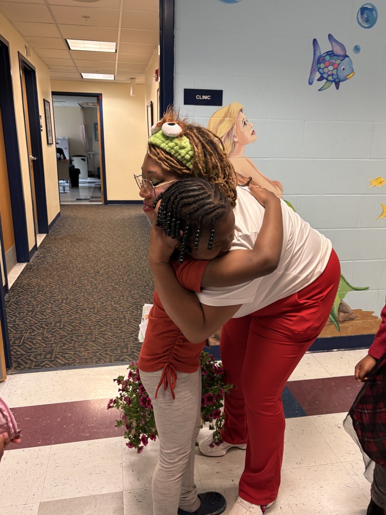 Nurse Dom hugging student