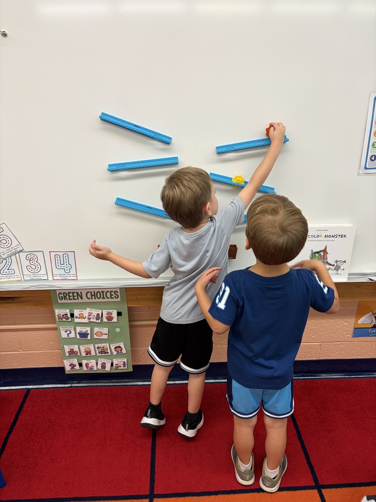 Students playing with marbles.