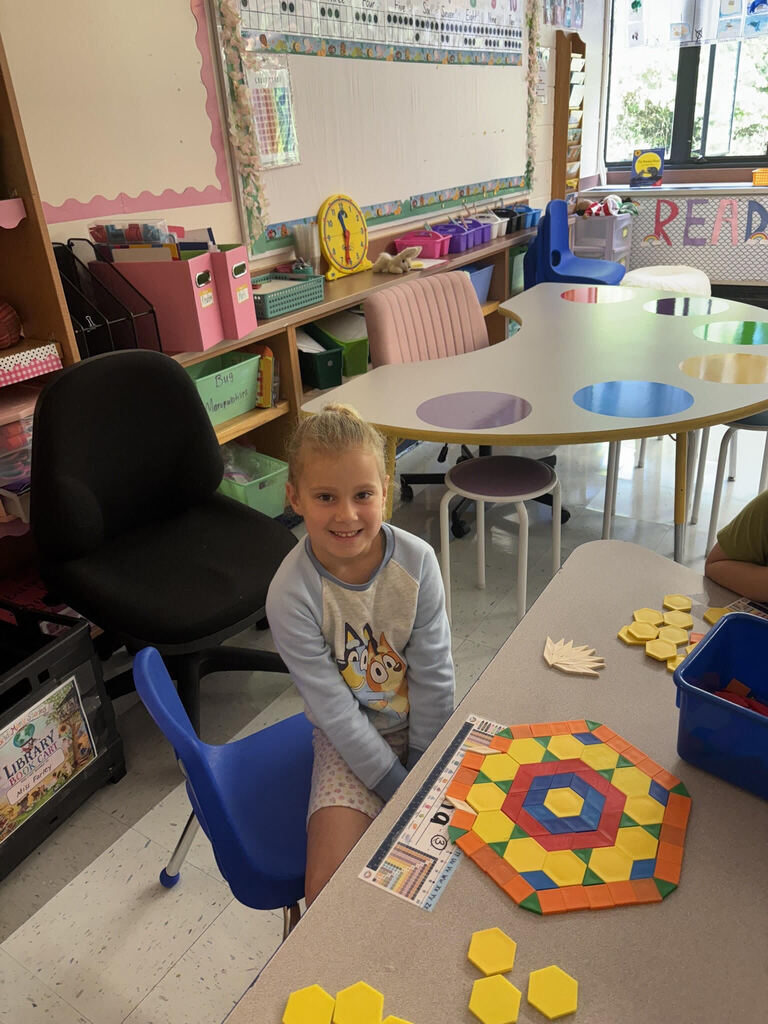 Girl placing shapes