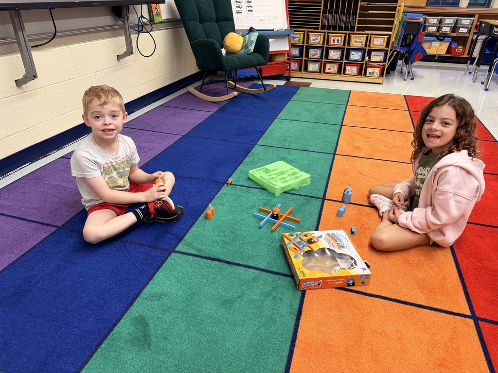 Students playing tic tac toe.
