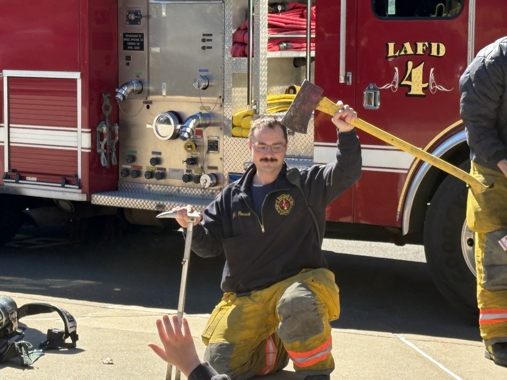 Firefighters showing an ax.