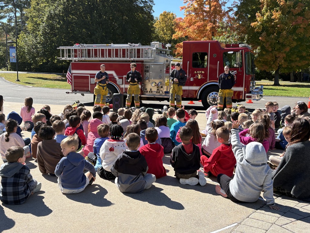 Firefighters taking questions from students.