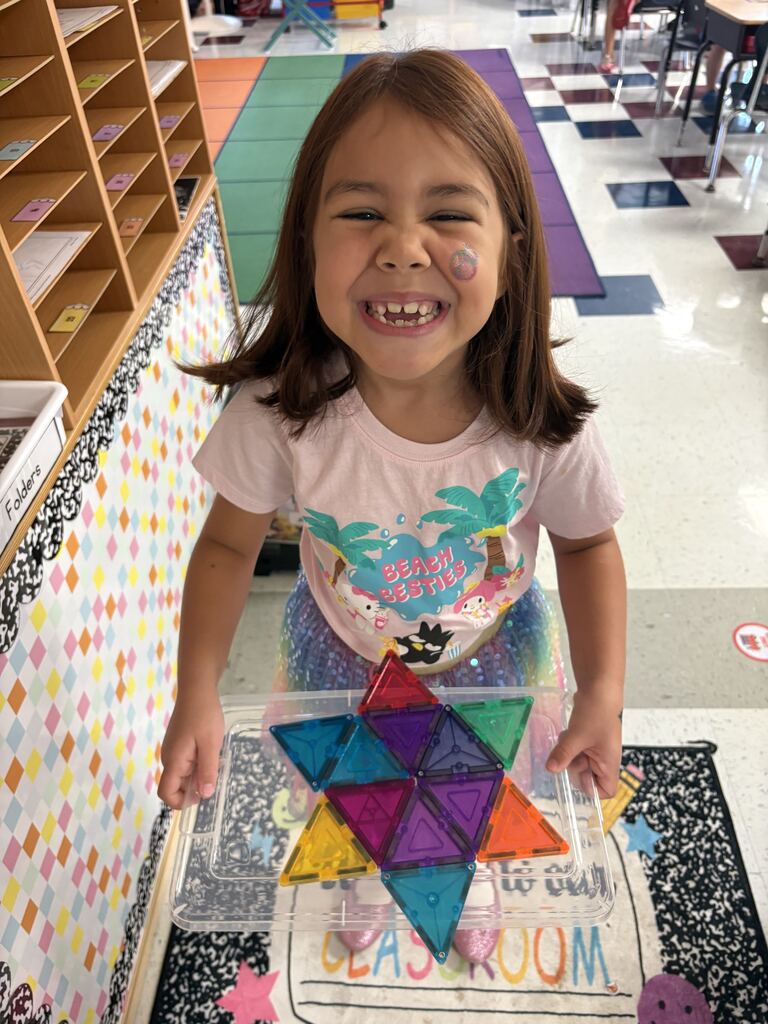 Student showing her magnetic star. 